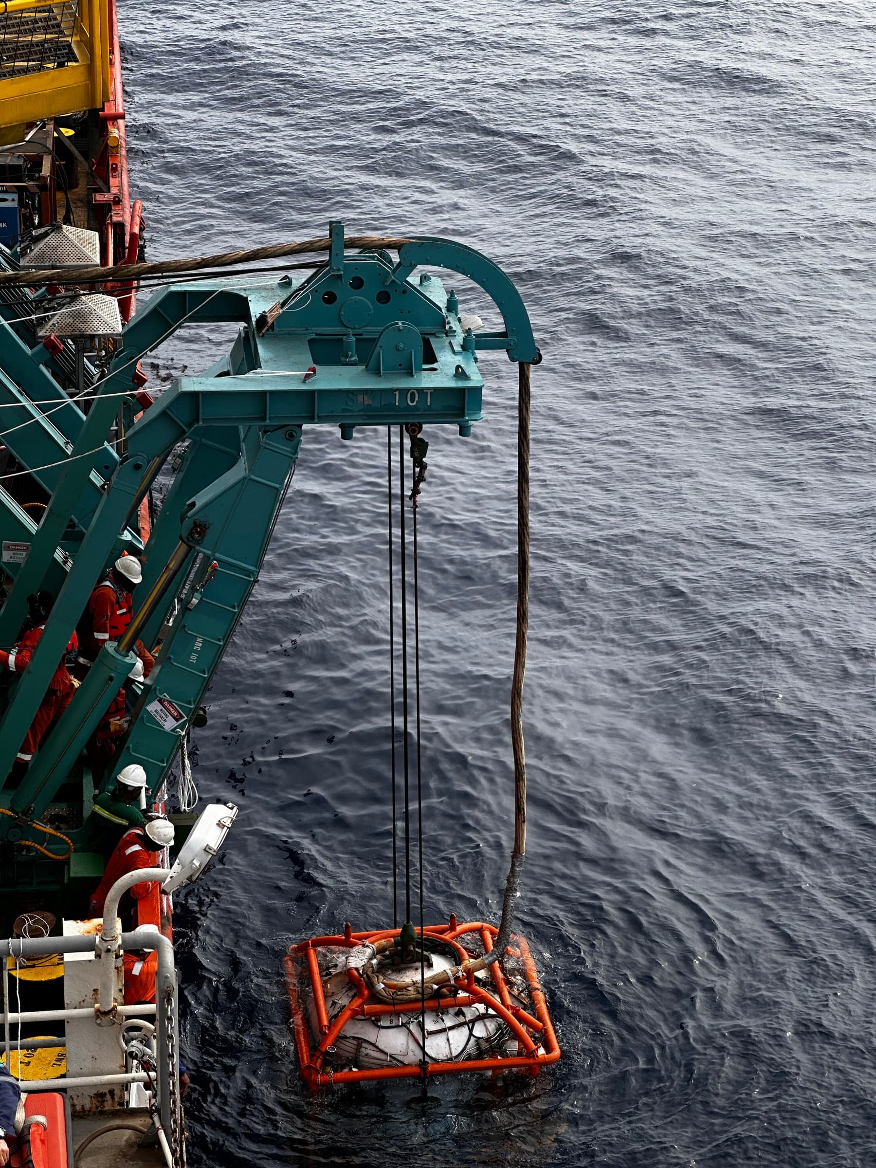 Diving basket being launched from the vessel A-frame